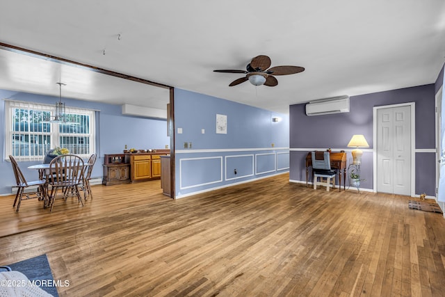 1341 1st Ave, Toms River, NJ 08757 - living area with a ceiling fan, light wood finished floors, and a wall mounted AC