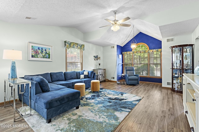 1887 Crimson Ct, Toms River, NJ 08755 - living area with lofted ceiling, a ceiling fan, healthy amount of natural light, wood finished floors, and a textured ceiling