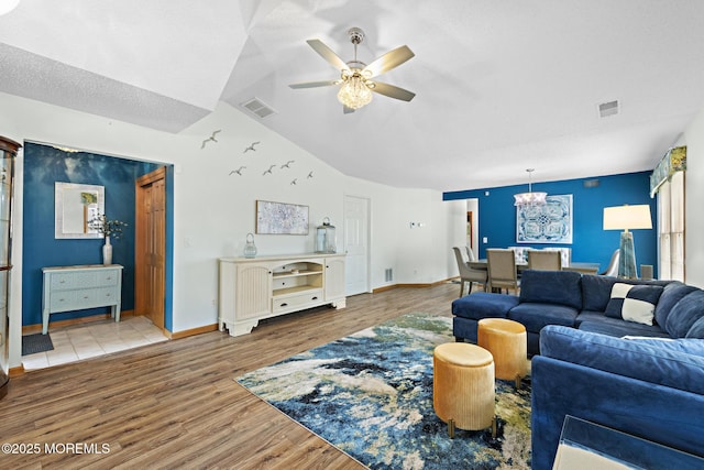 1887 Crimson Ct, Toms River, NJ 08755 - living room featuring wood finished floors, ceiling fan, lofted ceiling, and a chandelier