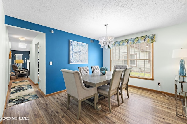 1887 Crimson Ct, Toms River, NJ 08755 - dining area with a chandelier, wood finished floors, and a textured ceiling