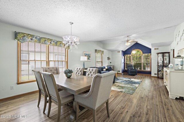 1887 Crimson Ct, Toms River, NJ 08755 - dining room featuring a chandelier, a textured ceiling, wood finished floors, ceiling fan, and lofted ceiling