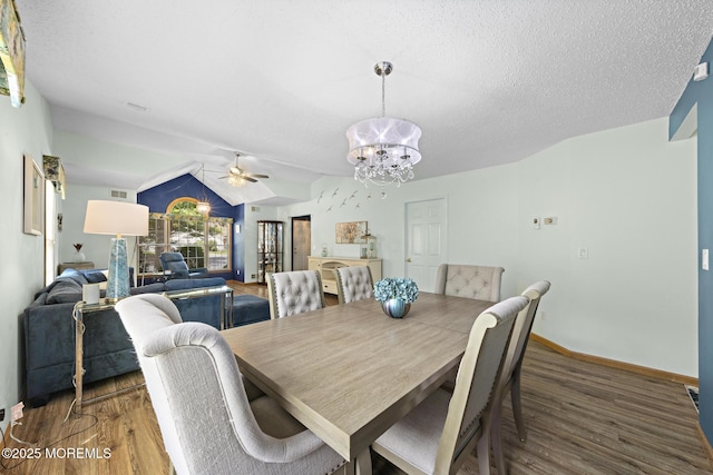 1887 Crimson Ct, Toms River, NJ 08755 - dining area with a chandelier, wood finished floors, ceiling fan, vaulted ceiling, and a textured ceiling