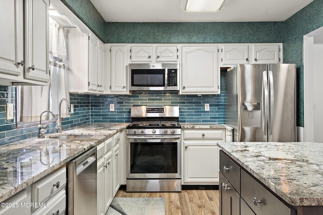 1887 Crimson Ct, Toms River, NJ 08755 - kitchen featuring stainless steel appliances, light wood finished floors, white cabinets, and decorative backsplash