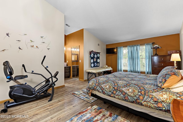 1887 Crimson Ct, Toms River, NJ 08755 - bedroom featuring wood finished floors, lofted ceiling, and ensuite bath