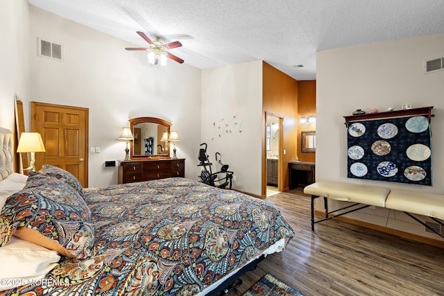 1887 Crimson Ct, Toms River, NJ 08755 - bedroom with wood finished floors, a textured ceiling, a towering ceiling, connected bathroom, and a ceiling fan