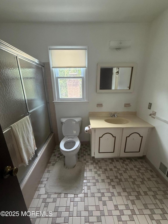 280 Mckinley Ave, Edison, NJ 08820 - bathroom featuring vanity and shower / bath combination with glass door