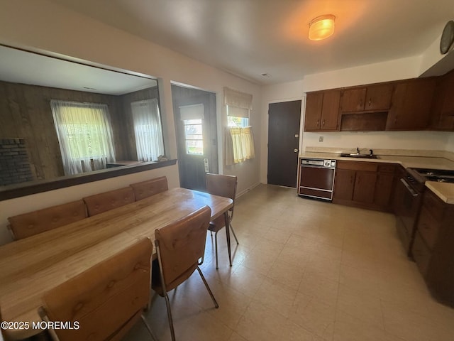 280 Mckinley Ave, Edison, NJ 08820 - kitchen featuring dishwashing machine, black gas range, light countertops, and light flooring
