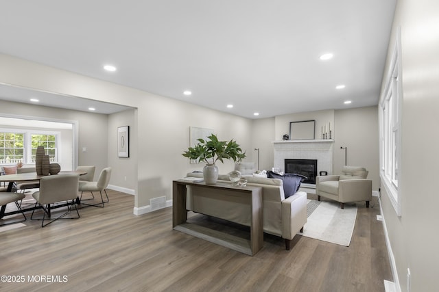 13 Pinehurst Dr, Little Egg Harbor, NJ 08087 - living room with a glass covered fireplace, wood finished floors, and recessed lighting