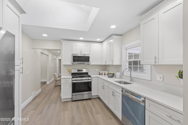 13 Pinehurst Dr, Little Egg Harbor, NJ 08087 - kitchen with stainless steel appliances, light wood-style flooring, white cabinetry, and recessed lighting