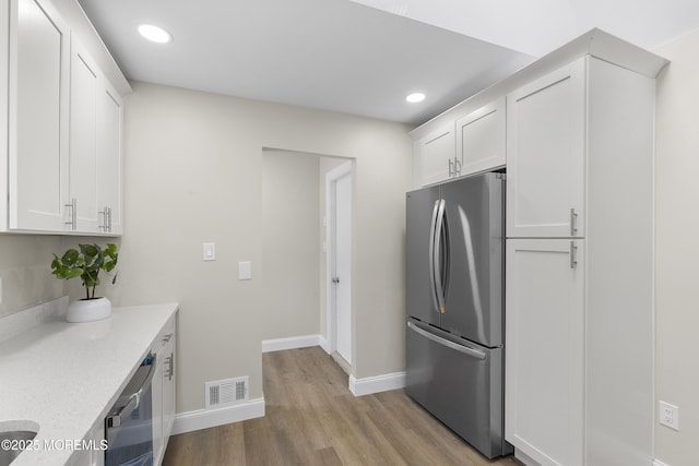 13 Pinehurst Dr, Little Egg Harbor, NJ 08087 - kitchen featuring appliances with stainless steel finishes, white cabinetry, light wood finished floors, recessed lighting, and light stone counters