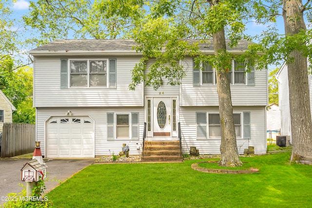 24 Roosevelt Dr, Brick, NJ 08724 - raised ranch with an attached garage and driveway