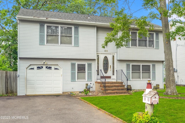 24 Roosevelt Dr, Brick, NJ 08724 - bi-level home with a garage and asphalt driveway