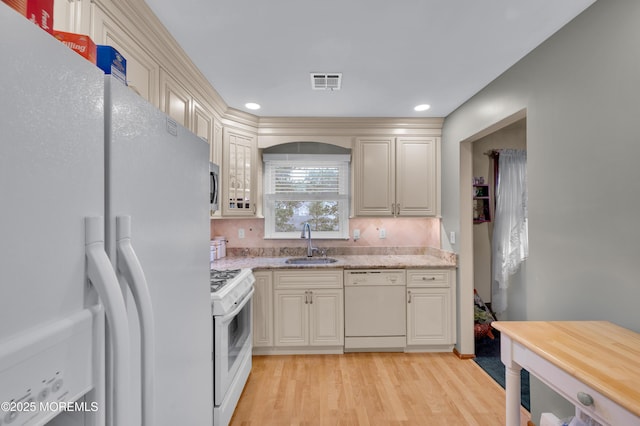 24 Roosevelt Dr, Brick, NJ 08724 - kitchen with white appliances, light wood finished floors, light stone countertops, recessed lighting, and glass insert cabinets