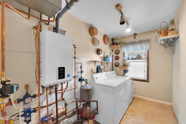 24 Roosevelt Dr, Brick, NJ 08724 - laundry room with water heater, washer and clothes dryer, and rail lighting