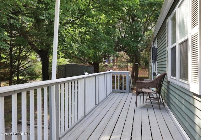 147 Redwood Dr, Barnegat, NJ 08005 - wooden terrace featuring a storage shed