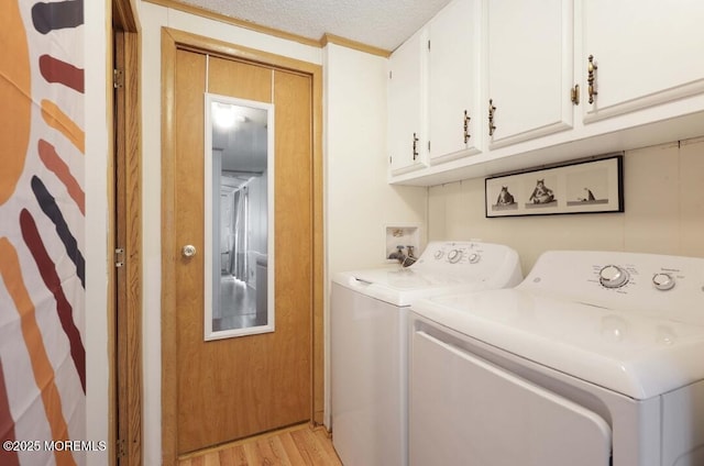 147 Redwood Dr, Barnegat, NJ 08005 - laundry area with independent washer and dryer, cabinet space, light wood-style flooring, and a textured ceiling