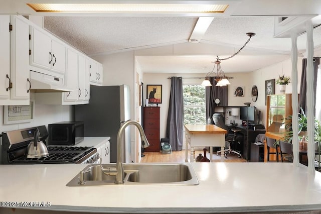 147 Redwood Dr, Barnegat, NJ 08005 - kitchen with under cabinet range hood, light countertops, appliances with stainless steel finishes, white cabinetry, and an office area