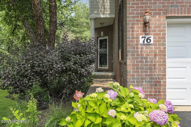 76 Deepwater Cir, Manalapan, NJ 07726 - entrance to property with brick siding and an attached garage