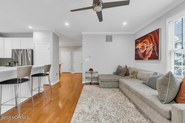 76 Deepwater Cir, Manalapan, NJ 07726 - living room featuring crown molding, a ceiling fan, light wood finished floors, and recessed lighting