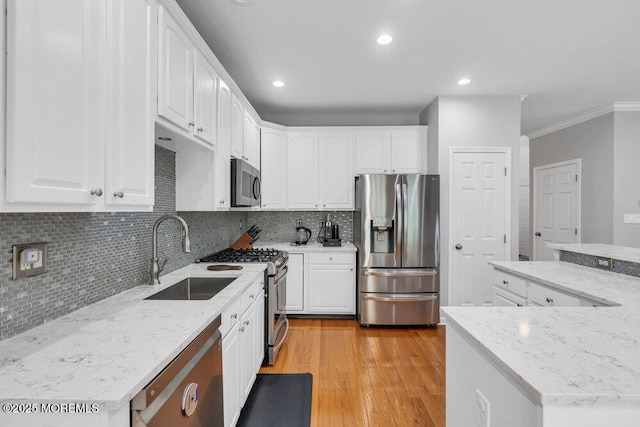 76 Deepwater Cir, Manalapan, NJ 07726 - kitchen with stainless steel appliances, crown molding, white cabinets, and recessed lighting