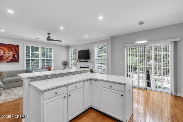 76 Deepwater Cir, Manalapan, NJ 07726 - kitchen featuring open floor plan, a ceiling fan, recessed lighting, white cabinets, and light wood-style flooring