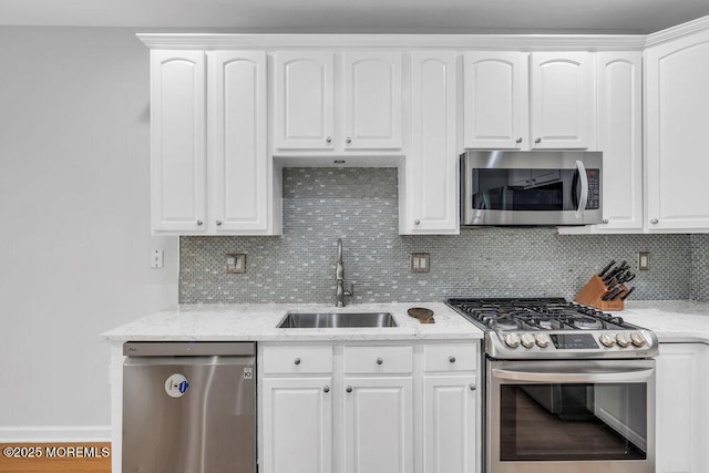 76 Deepwater Cir, Manalapan, NJ 07726 - kitchen with stainless steel appliances, decorative backsplash, white cabinetry, and light stone countertops