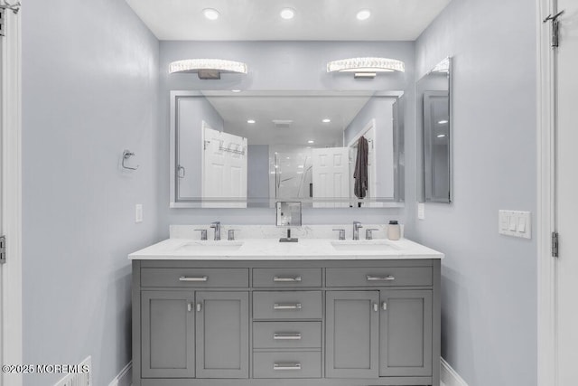 76 Deepwater Cir, Manalapan, NJ 07726 - bathroom featuring double vanity, a shower with door, and recessed lighting