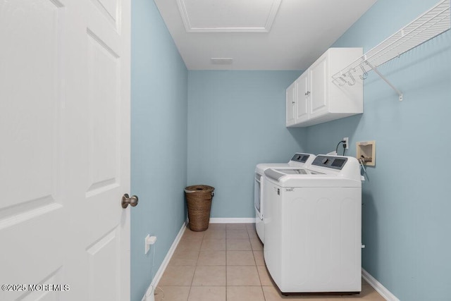 76 Deepwater Cir, Manalapan, NJ 07726 - laundry area with washing machine and clothes dryer, cabinet space, and light tile patterned floors