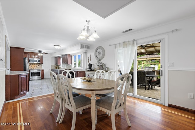 16 8th Ave, Monroe, NJ 08831 - dining room with a chandelier and light wood-style flooring