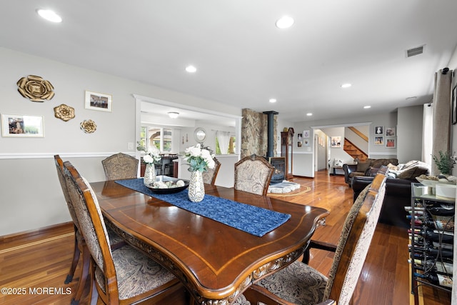 16 8th Ave, Monroe, NJ 08831 - dining space featuring stairs, wood-type flooring, recessed lighting, and a wood stove