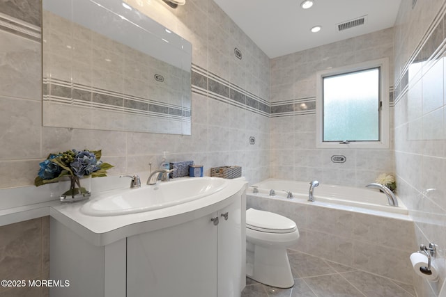 16 8th Ave, Monroe, NJ 08831 - full bathroom with tile walls, a bath, vanity, tile patterned flooring, and recessed lighting