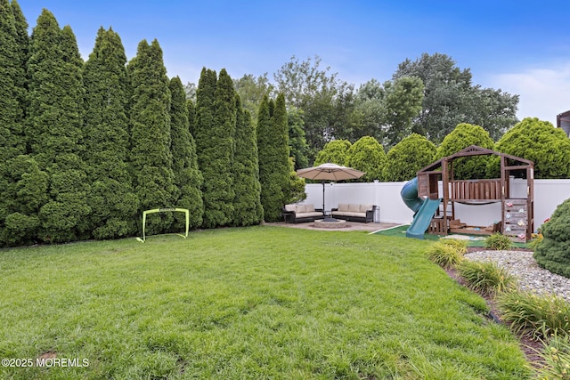 16 8th Ave, Monroe, NJ 08831 - fenced backyard featuring an outdoor living space, a playground, and a gazebo