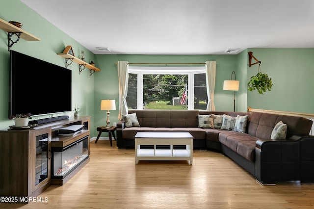 180 Grand Ave, Atlantic Highlands, NJ 07716 - living area featuring wood finished floors and a glass covered fireplace
