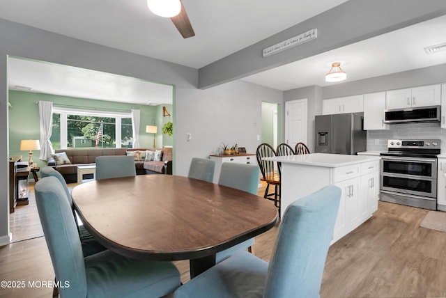 180 Grand Ave, Atlantic Highlands, NJ 07716 - dining space with light wood finished floors and ceiling fan