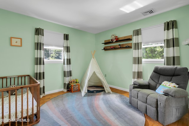 180 Grand Ave, Atlantic Highlands, NJ 07716 - bedroom featuring multiple windows and wood finished floors
