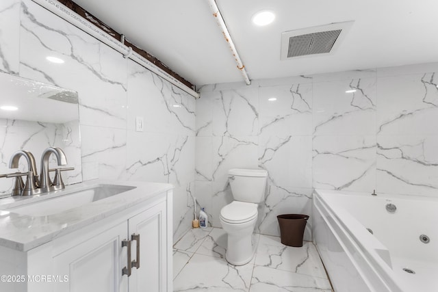 405 Hope Chapel Rd, Lakewood, NJ 08701 - bathroom with tile walls, vanity, a jetted tub, and marble tiled floors