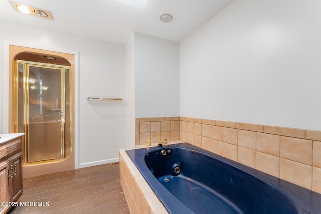 405 Hope Chapel Rd, Lakewood, NJ 08701 - bathroom featuring a jetted tub, vanity, a shower stall, and wood finished floors
