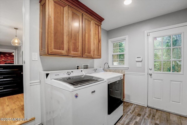 13 Manalapan Woods Dr, Manalapan, NJ 07726 - laundry room featuring cabinet space, washer and dryer, light wood-style flooring, and wainscoting