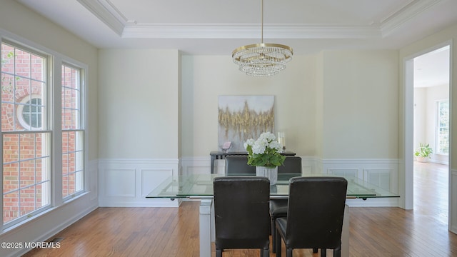18 Sage St, Holmdel, NJ 07733 - dining room with a chandelier, plenty of natural light, wood finished floors, wainscoting, and crown molding
