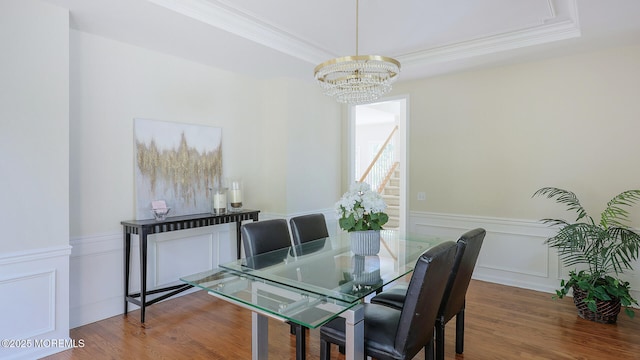 18 Sage St, Holmdel, NJ 07733 - dining space with a chandelier, crown molding, wainscoting, wood finished floors, and a decorative wall