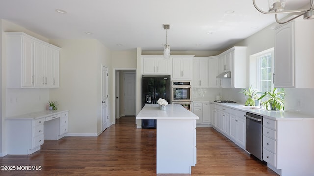 18 Sage St, Holmdel, NJ 07733 - kitchen with stainless steel appliances, wood finished floors, backsplash, white cabinets, and recessed lighting