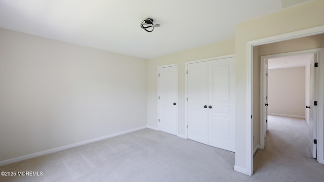 18 Sage St, Holmdel, NJ 07733 - unfurnished bedroom featuring light carpet and a closet
