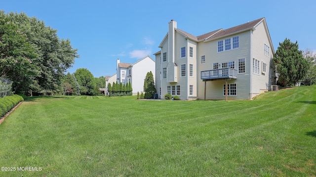 18 Sage St, Holmdel, NJ 07733 - rear view of property featuring a chimney and a yard