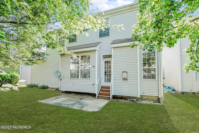 9 Mioduski Ct, Parlin, NJ 08859 - rear view of house with entry steps, a yard, and a patio area