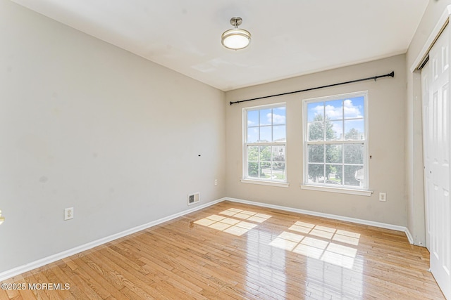 9 Mioduski Ct, Parlin, NJ 08859 - unfurnished room with baseboards and light wood-style flooring