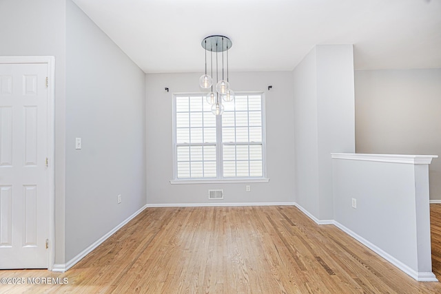9 Mioduski Ct, Parlin, NJ 08859 - unfurnished dining area with wood finished floors and baseboards