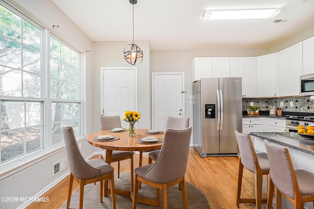 9 Mioduski Ct, Parlin, NJ 08859 - dining room featuring light wood-style floors and a chandelier