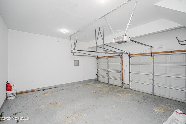 9 Mioduski Ct, Parlin, NJ 08859 - garage with a garage door opener and electric panel