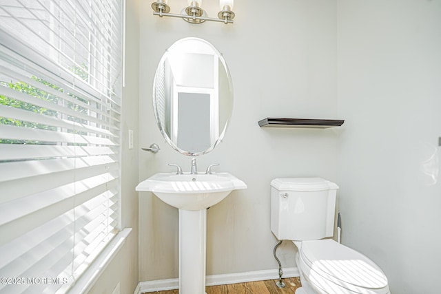 9 Mioduski Ct, Parlin, NJ 08859 - half bath with wood finished floors and a chandelier