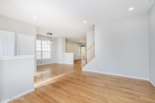 9 Mioduski Ct, Parlin, NJ 08859 - empty room featuring light wood finished floors, plenty of natural light, a chandelier, and recessed lighting